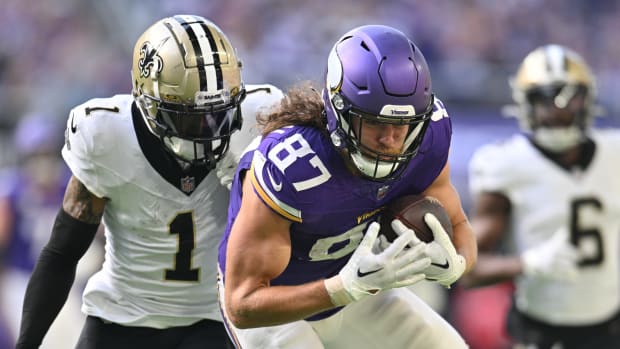Nov 12, 2023; Minneapolis, Minnesota, USA; Minnesota Vikings tight end T.J. Hockenson (87) is pursued by New Orleans Saints cornerback Alontae Taylor (1) during the second quarter at U.S. Bank Stadium.